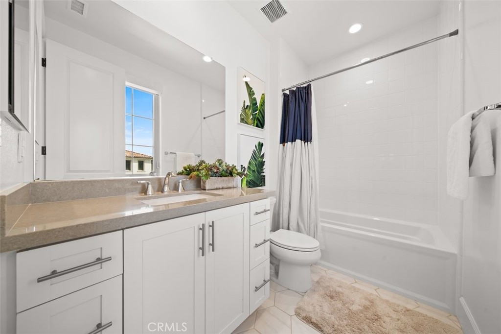 90 Rockinghorse Irvine, CA 92602 - Photo 22 of 30 a spacious bathroom with a granite countertop sink a toilet a mirror and shower