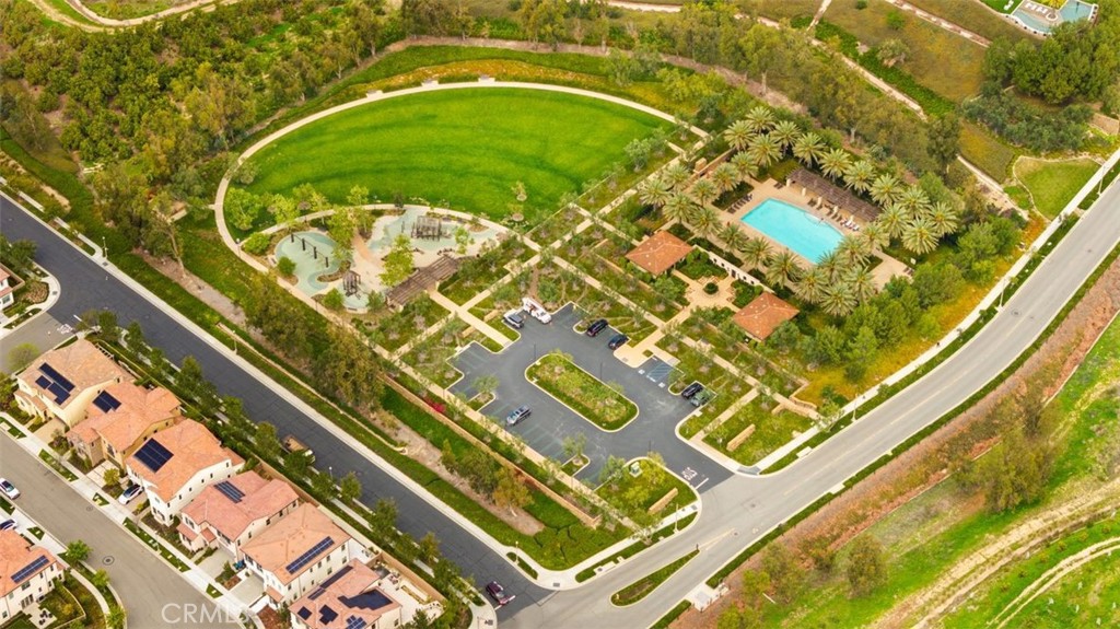 90 Rockinghorse Irvine, CA 92602 - Photo 28 of 30 a swimming pool with a garden and trees