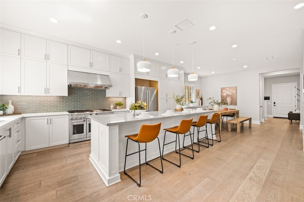 90 Rockinghorse Irvine, CA 92602 - Photo 9 of 30 a large kitchen with lots of counter space a sink and appliances