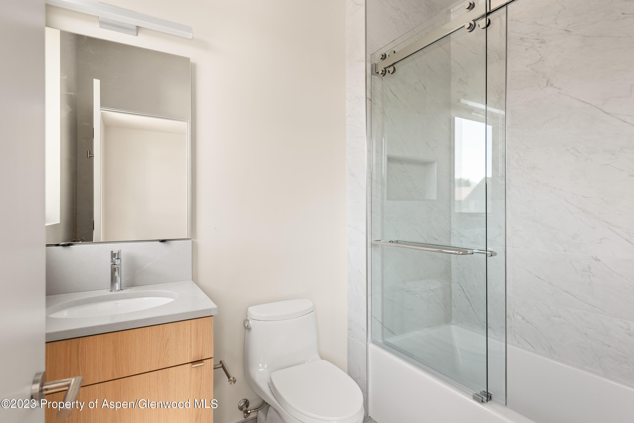 128 Valley Court Basalt, CO 81621 - Photo 11 of 12 a bathroom with a granite countertop sink toilet and shower