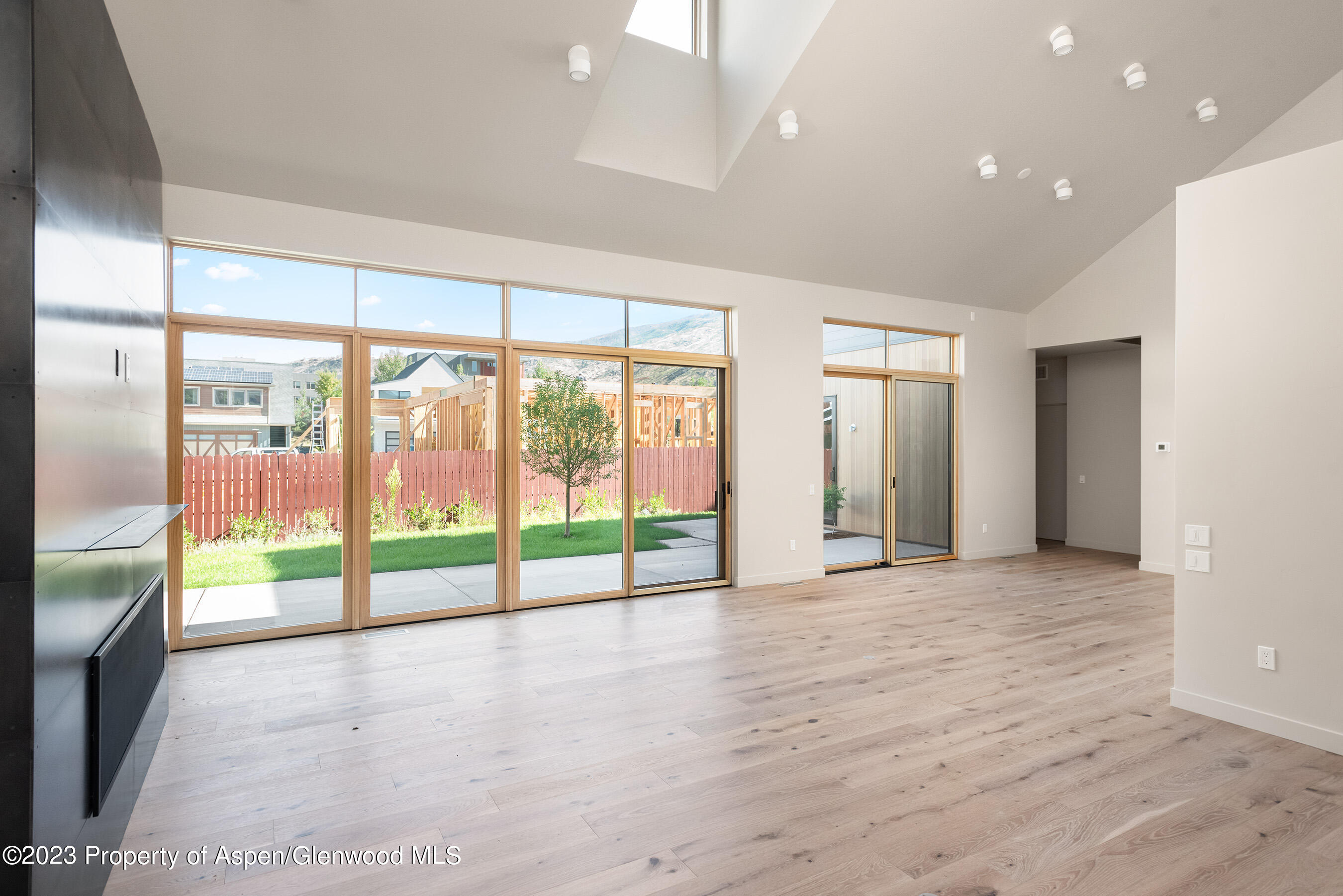 128 Valley Court Basalt, CO 81621 - Photo 4 of 12 a view of an empty room with a sliding door