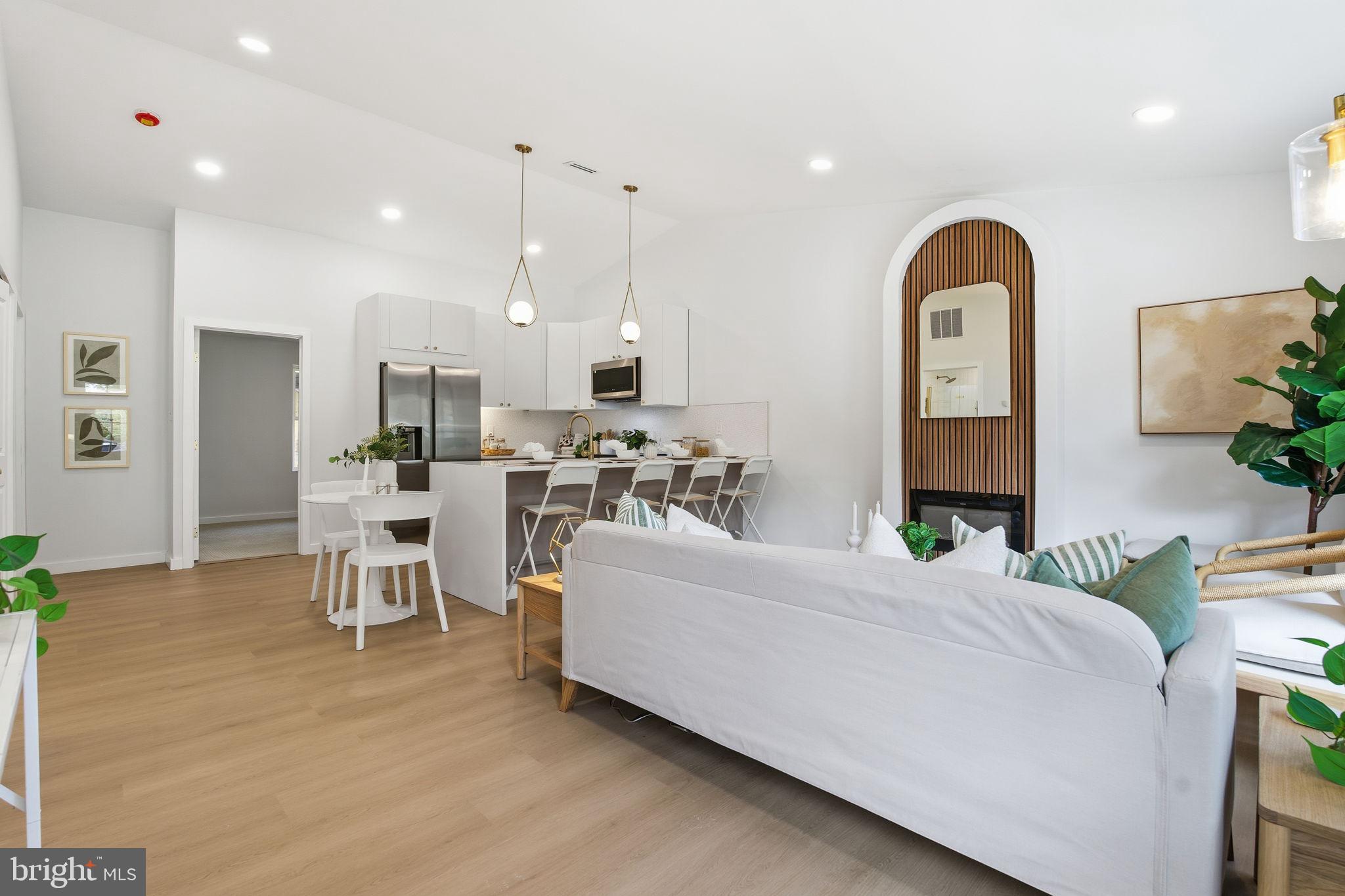 120 Haverhill Road Joppa, MD 21085 - Photo 14 of 33 a living room with furniture a chandelier and kitchen view