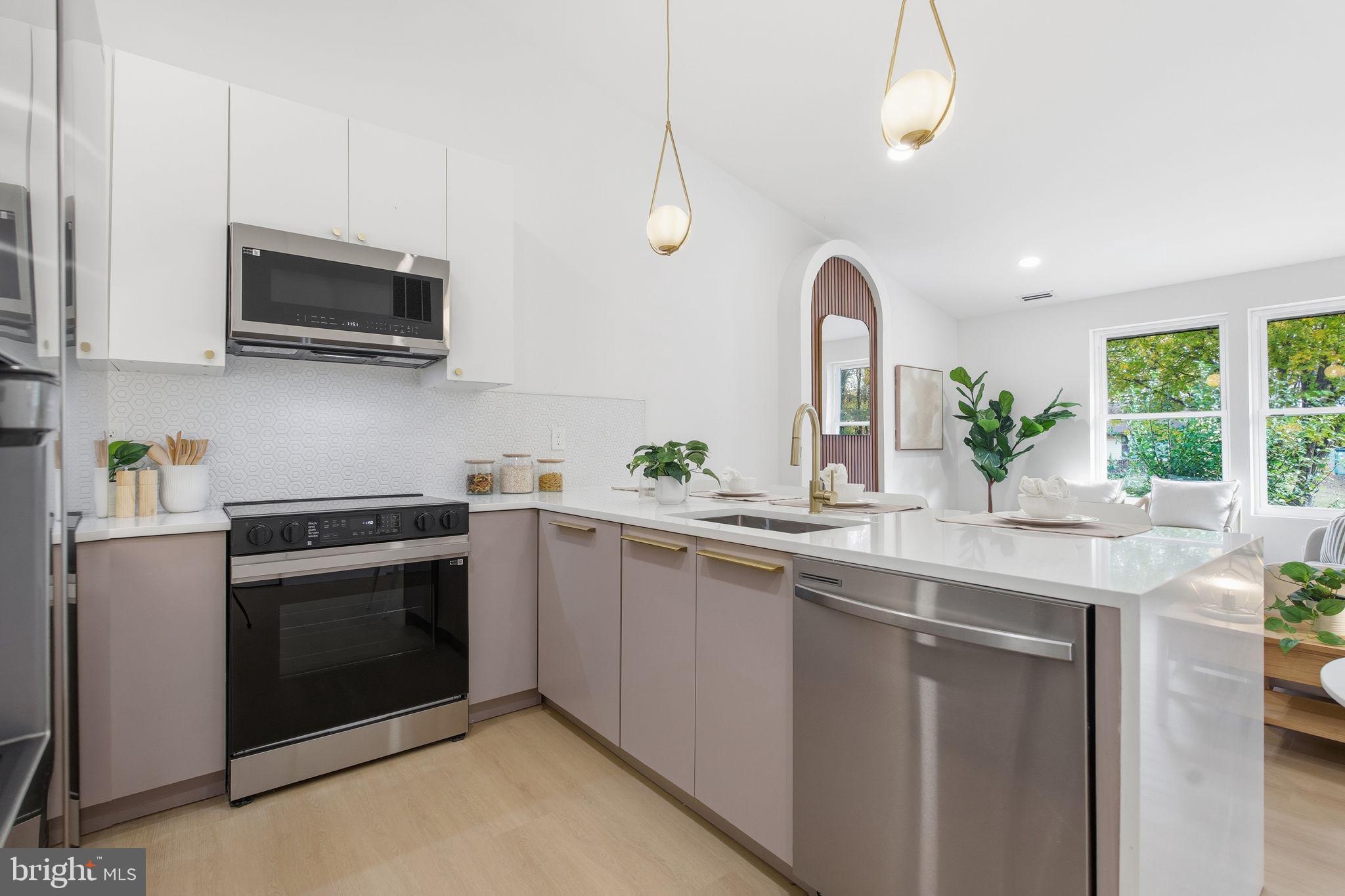 120 Haverhill Road Joppa, MD 21085 - Photo 2 of 33 a kitchen with stainless steel appliances granite countertop a sink and a microwave