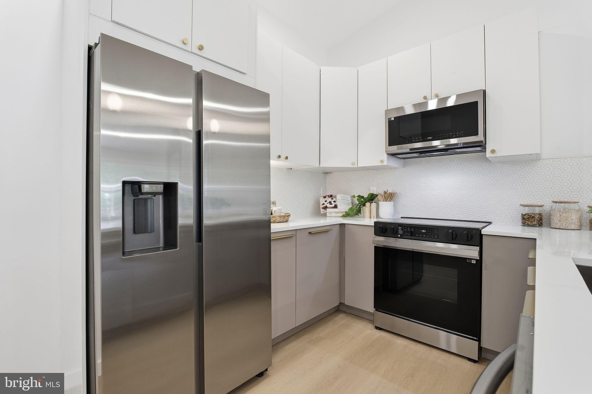 120 Haverhill Road Joppa, MD 21085 - Photo 7 of 33 a kitchen with stainless steel appliances granite countertop a refrigerator and a stove top oven