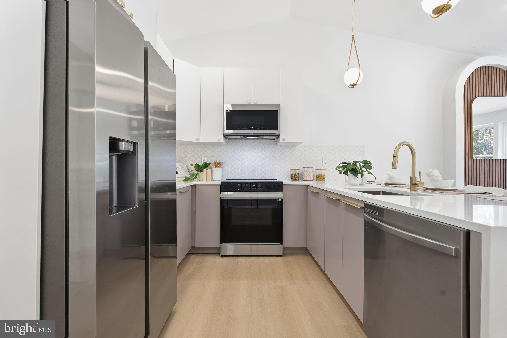 120 Haverhill Road Joppa, MD 21085 - Photo 8 of 33 a kitchen with stainless steel appliances a refrigerator sink and microwave