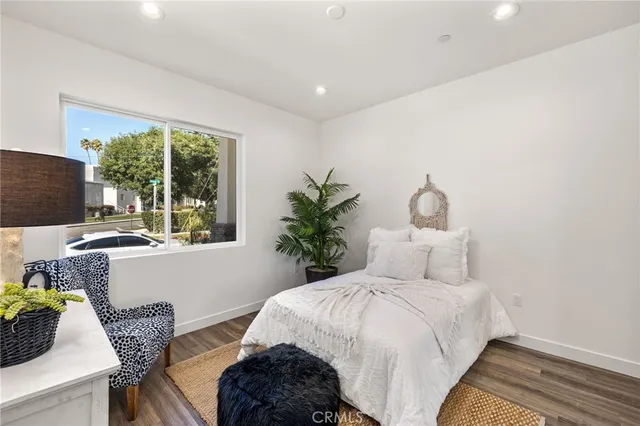 a bedroom with bed and a window