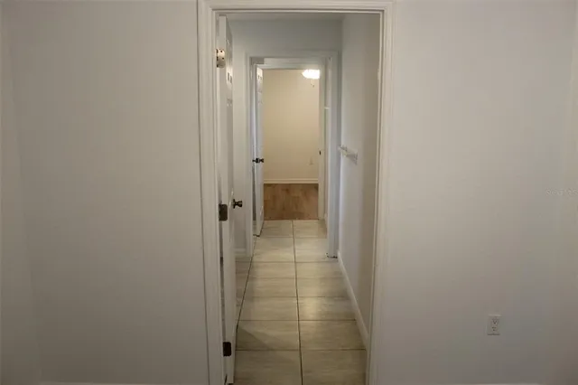 a view of a bathroom from a hallway