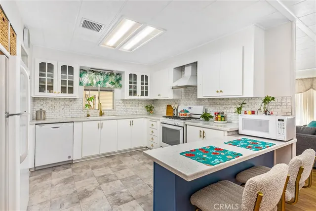 a kitchen with sink cabinets and window