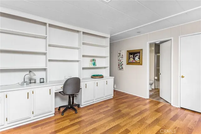 a workspace with furniture and window