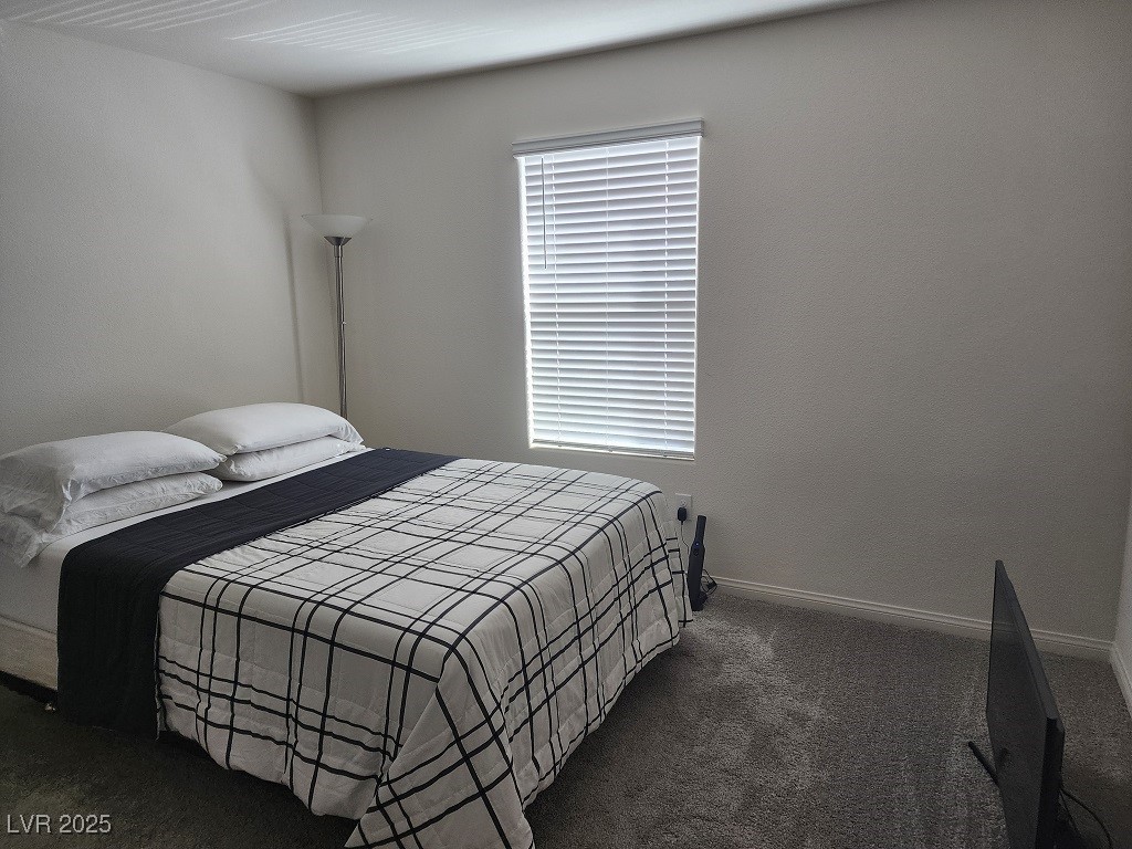 6925 Spicy Merlot Street North Las Vegas, NV 89086 - Photo 18 of 33 Bedroom featuring baseboards and carpet flooring