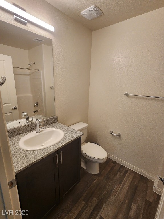 6925 Spicy Merlot Street North Las Vegas, NV 89086 - Photo 19 of 33 Full bathroom featuring toilet, wood finished floo
