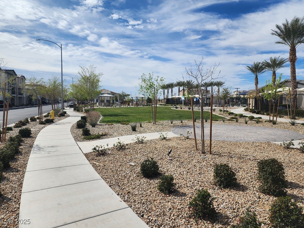 6925 Spicy Merlot Street North Las Vegas, NV 89086 - Photo 22 of 33 View of property's community featuring a yard and