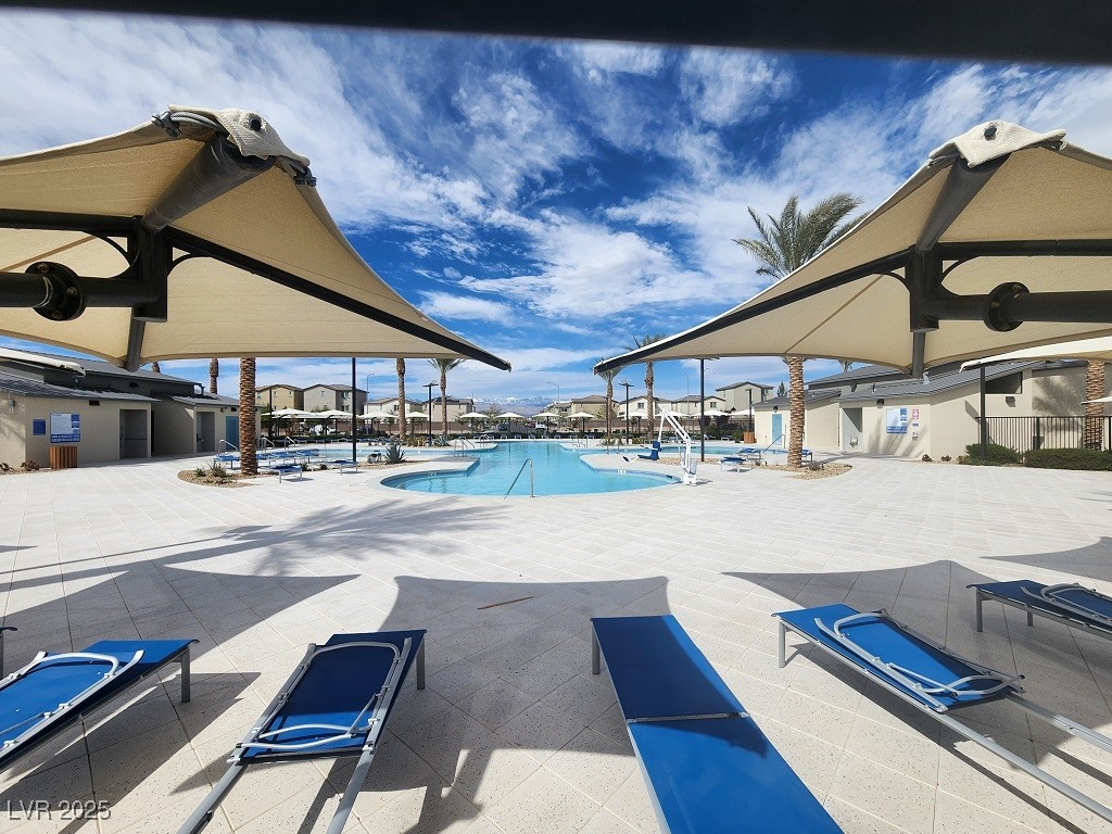 6925 Spicy Merlot Street North Las Vegas, NV 89086 - Photo 23 of 33 Community pool featuring a patio