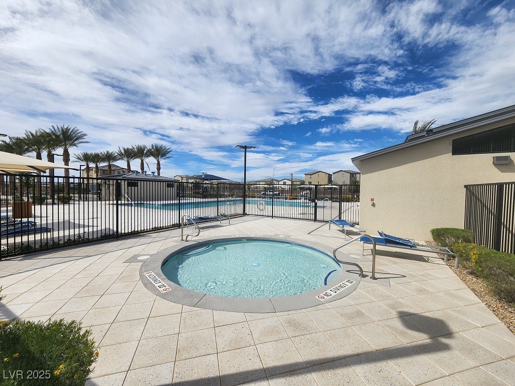 6925 Spicy Merlot Street North Las Vegas, NV 89086 - Photo 25 of 33 Pool featuring a patio area and fence