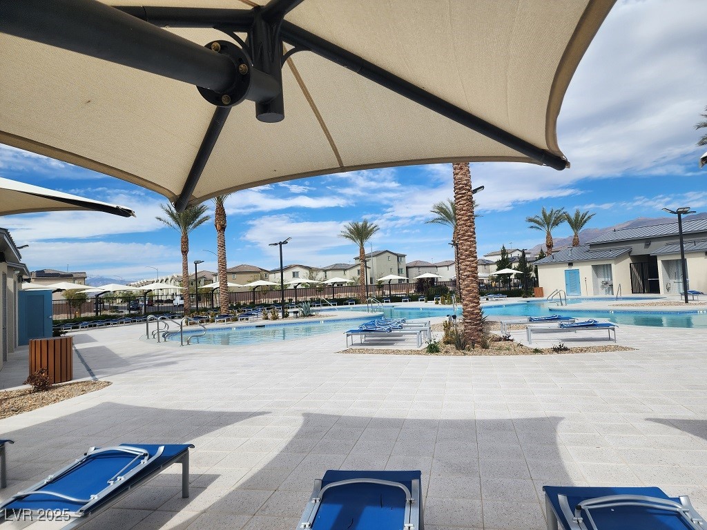 6925 Spicy Merlot Street North Las Vegas, NV 89086 - Photo 30 of 33 Pool featuring a residential view, fence, a ceilin