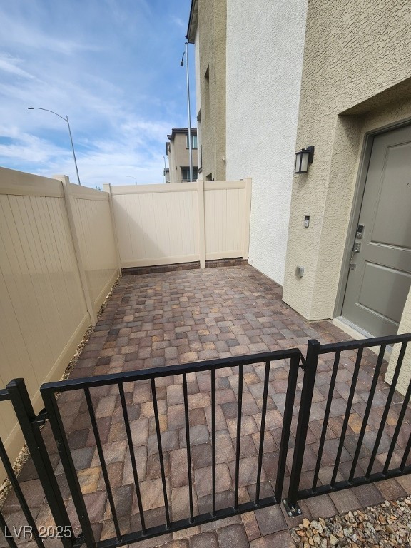 6925 Spicy Merlot Street North Las Vegas, NV 89086 - Photo 3 of 33 View of patio / terrace featuring a fenced backyar