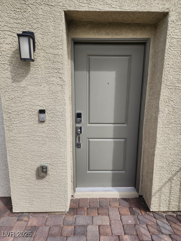 6925 Spicy Merlot Street North Las Vegas, NV 89086 - Photo 4 of 33 Property entrance featuring stucco siding