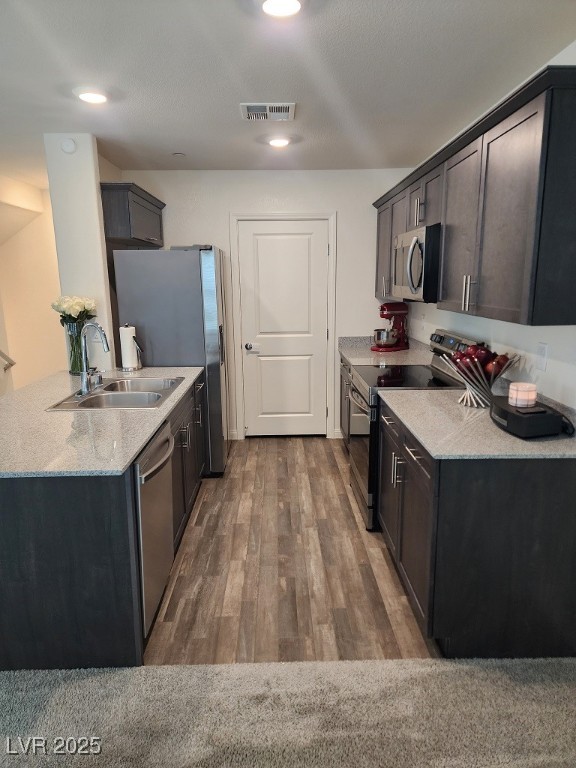 6925 Spicy Merlot Street North Las Vegas, NV 89086 - Photo 8 of 33 Kitchen with light stone counters, wood finished f