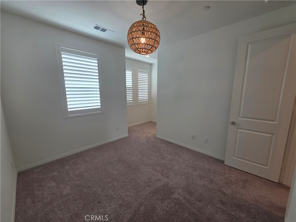 120 Rondo Irvine, CA 92618 - Photo 12 of 23 an empty room with a window and a fan