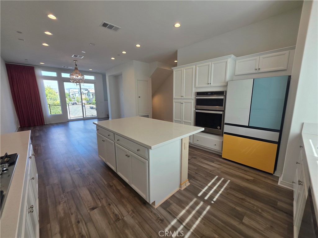 120 Rondo Irvine, CA 92618 - Photo 2 of 23 a kitchen with stainless steel appliances a refrigerator and a stove top oven