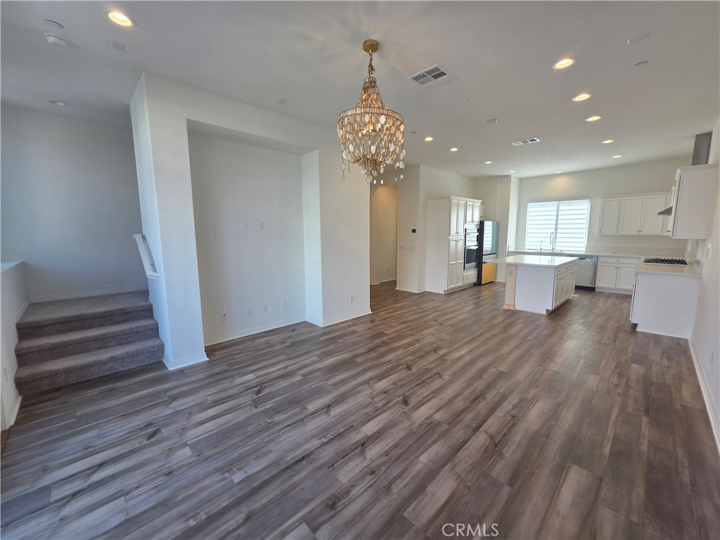 120 Rondo Irvine, CA 92618 - Photo 4 of 23 a view of a room with wooden floor and window