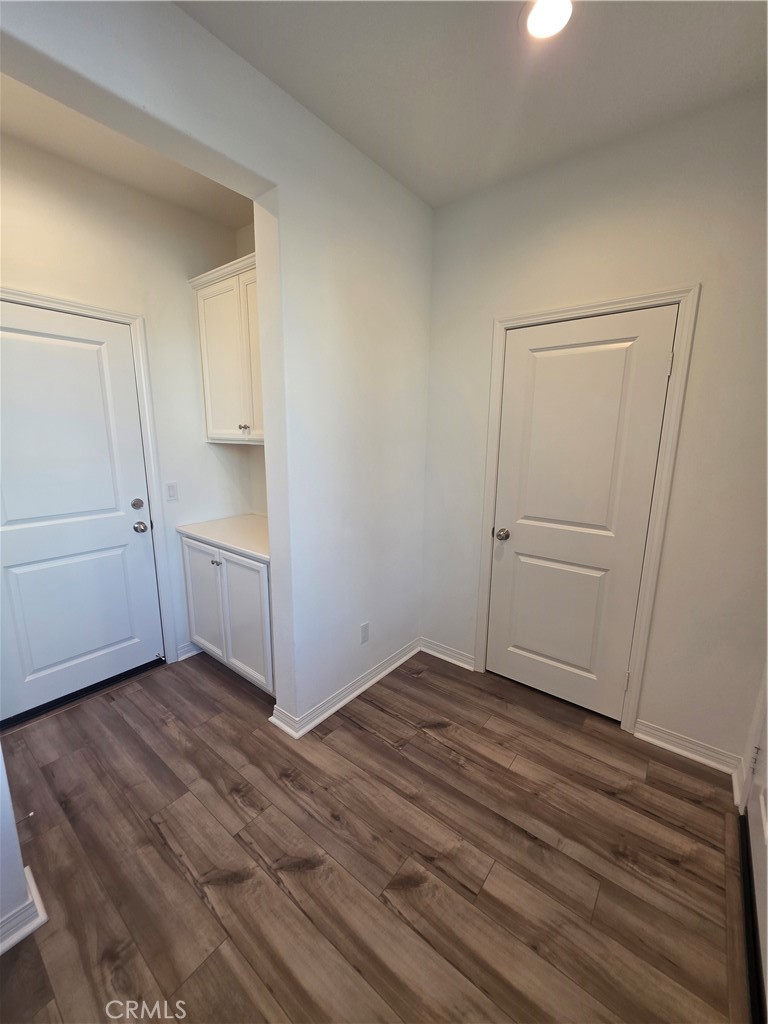 120 Rondo Irvine, CA 92618 - Photo 8 of 23 a view of an empty room with closet and wooden floor