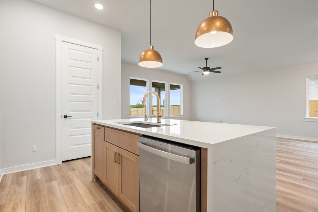 16201 Smithers Road Manor, TX 78653 - Photo 20 of 40 a kitchen with cabinets and chandelier