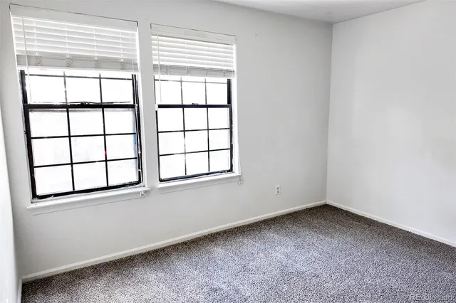 an empty room with closet area