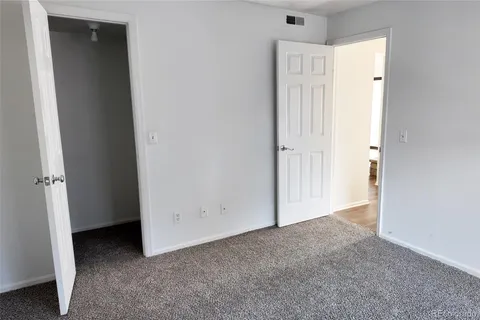 a view of an empty room and a window