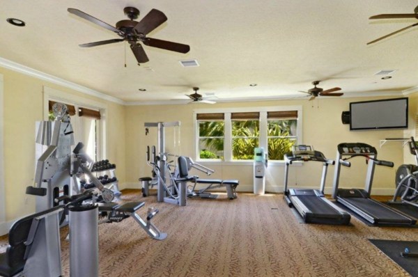 2373 Ho'ohu Road, Unit E111 Koloa, HI 96756 - Photo 11 of 16 a living room with furniture gym equipment and a large window