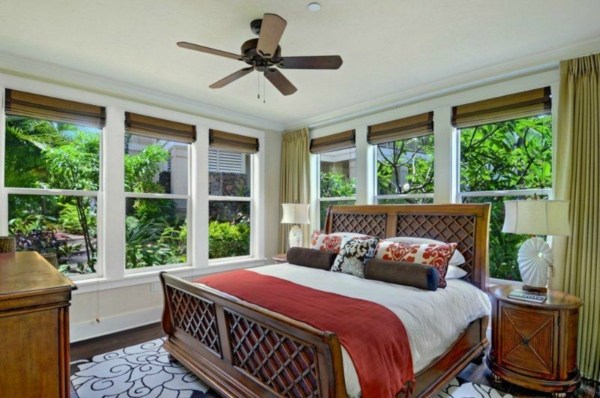 2373 Ho'ohu Road, Unit E111 Koloa, HI 96756 - Photo 5 of 16 a bedroom with a large bed and a large window