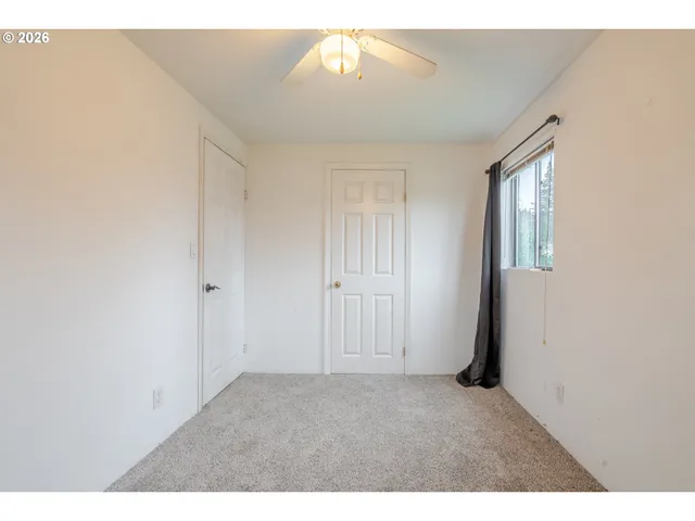 a view of an empty room and window