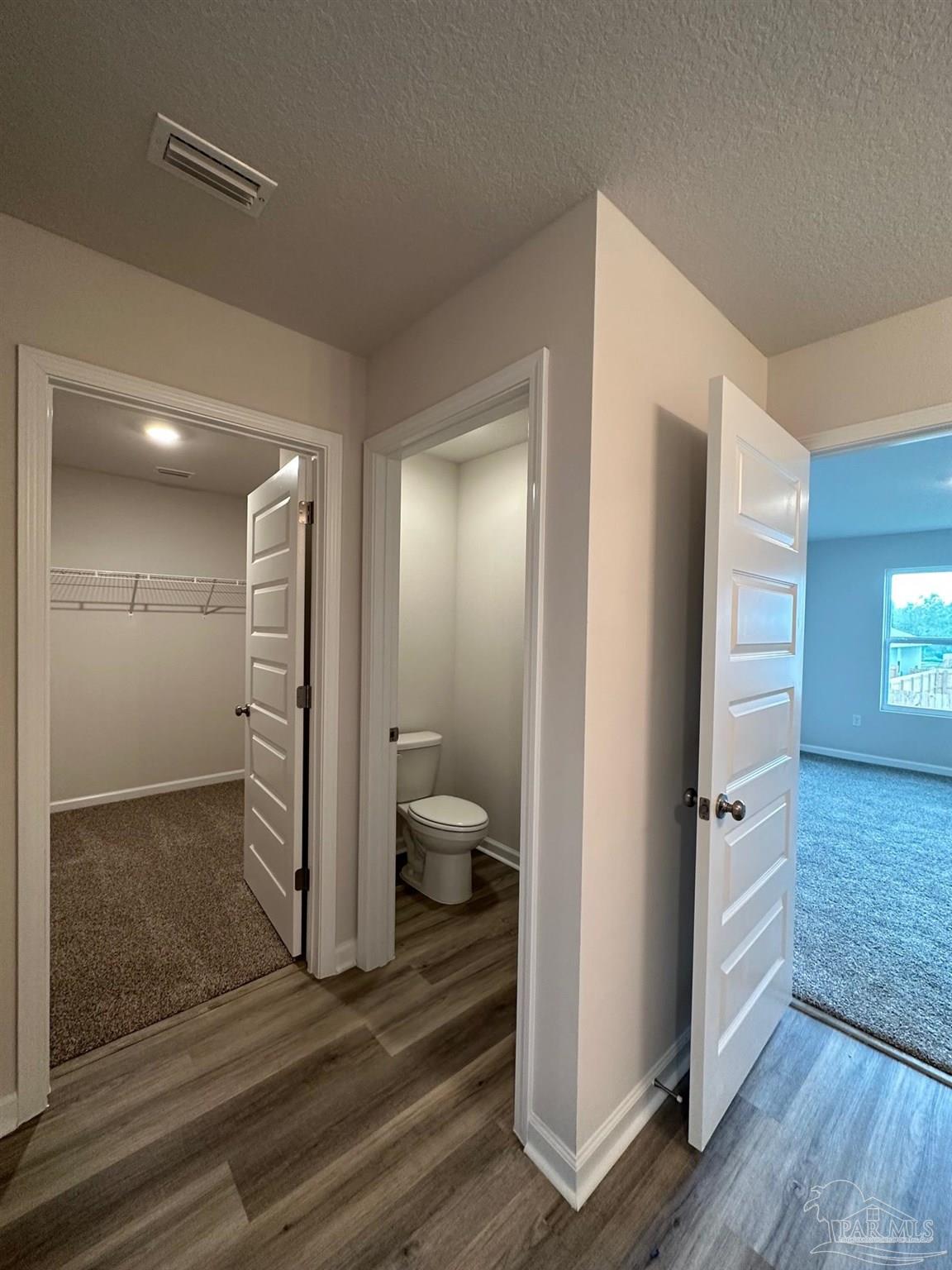4378 Redbay Court Pace, FL 32571 - Photo 25 of 30 a bathroom with a shower and a toilet