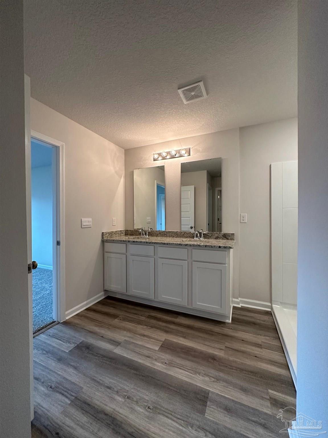 4378 Redbay Court Pace, FL 32571 - Photo 27 of 30 a view of a double vanity sink and a mirror