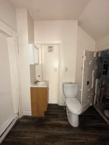 a white toilet sitting next to a bathroom sink