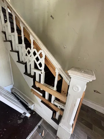 a view of an entryway with wooden floor
