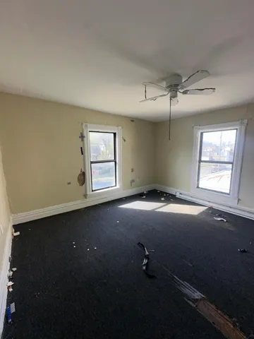 wooden floor and window in an empty room