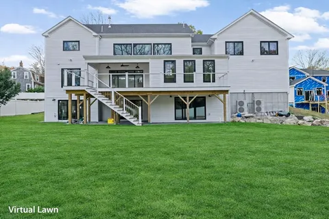 a view of an apartment with a house and garden
