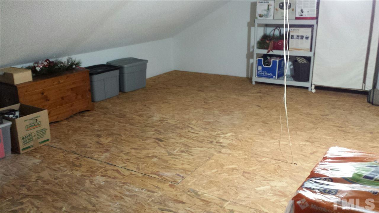 10001 Goodview Court Raleigh, NC 27613 - Photo 21 of 25 Huge walk-up storage loft over the garage- tons of storage!!