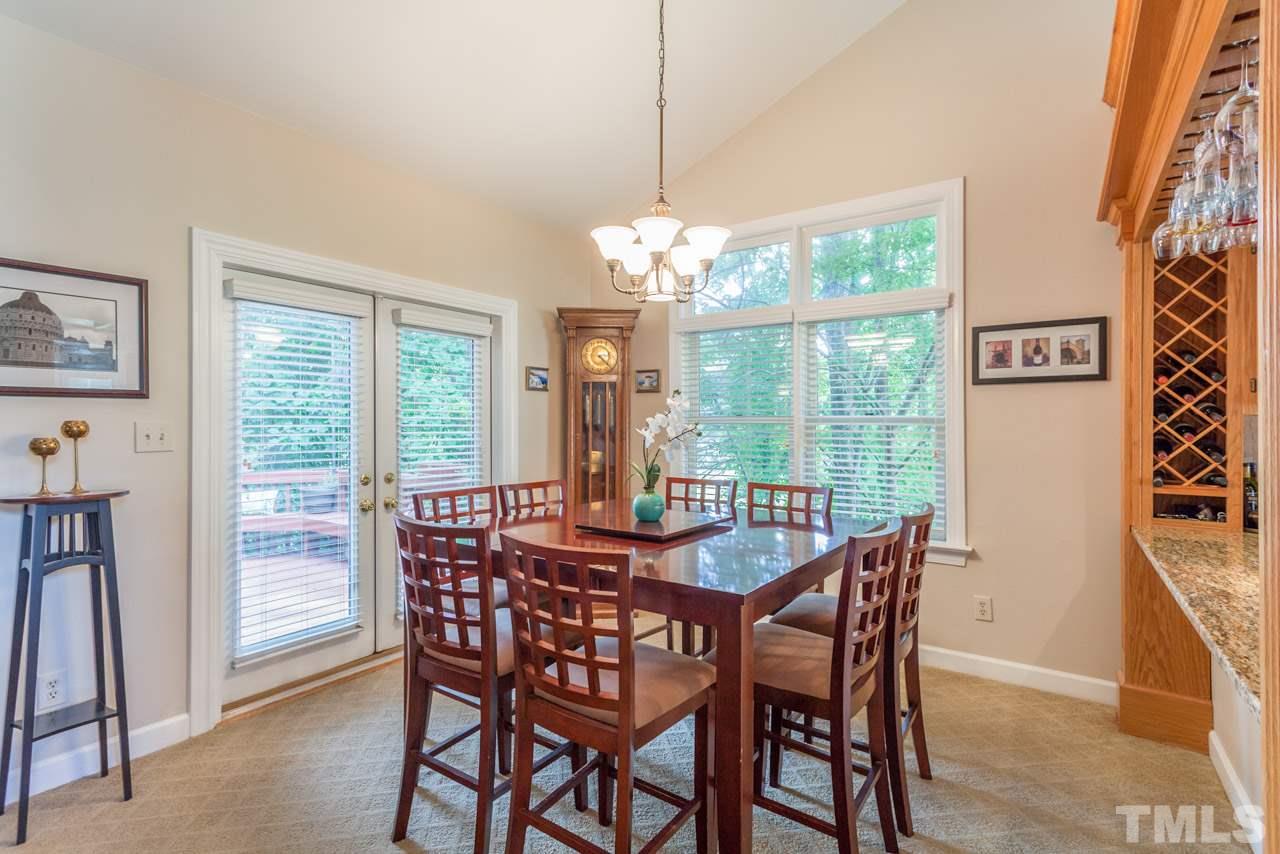 10001 Goodview Court Raleigh, NC 27613 - Photo 9 of 25 Bright dining room with french doors that lead to the deck
