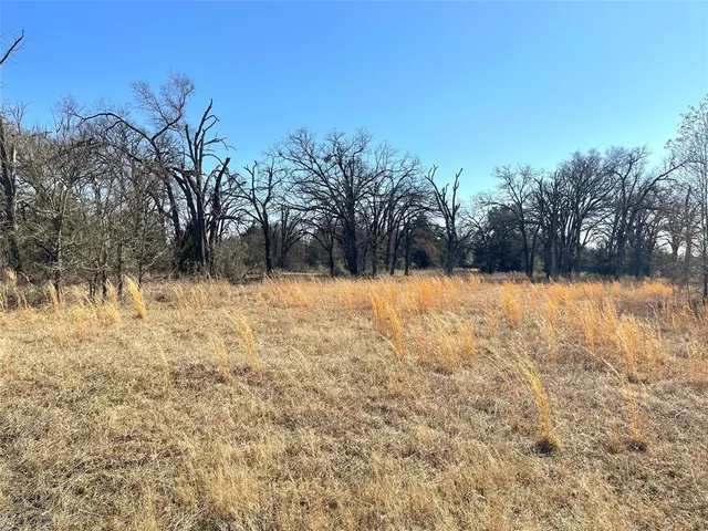 a view of a lake view with mountain in the background