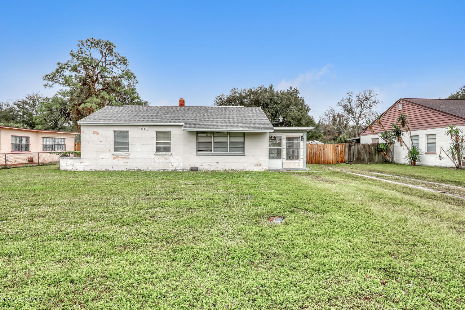 1003 Pinedale Road Rockledge, FL 32955 - Photo 1 of 19 a front view of a house with a garden