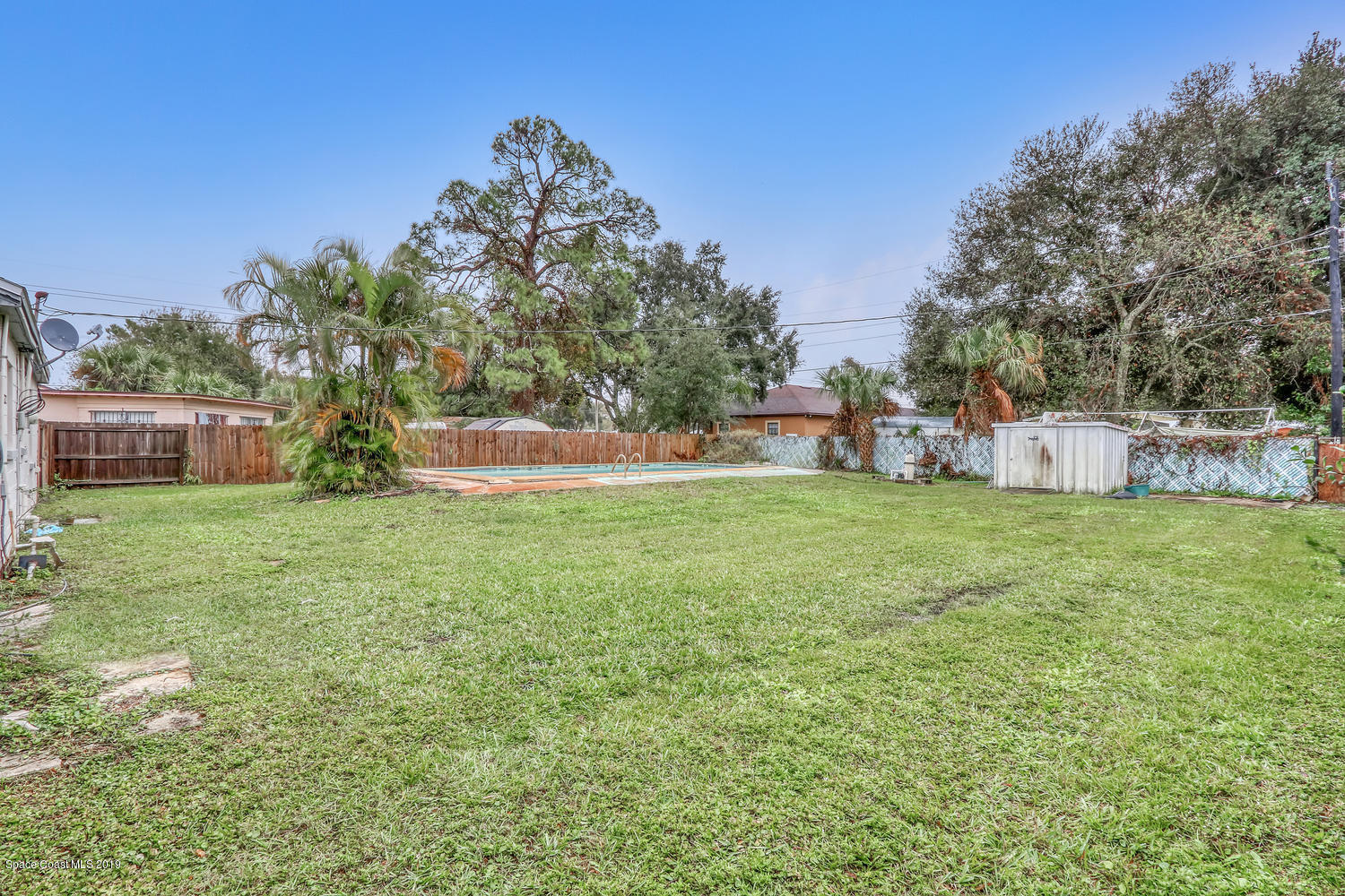 1003 Pinedale Road Rockledge, FL 32955 - Photo 15 of 19 a view of a house with a yard and sitting area