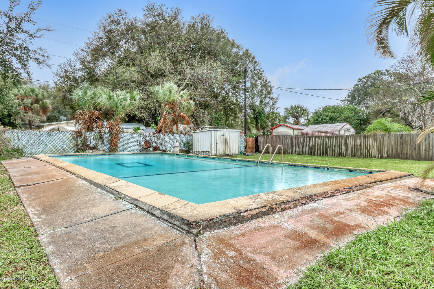 1003 Pinedale Road Rockledge, FL 32955 - Photo 17 of 19 a view of a house with a yard