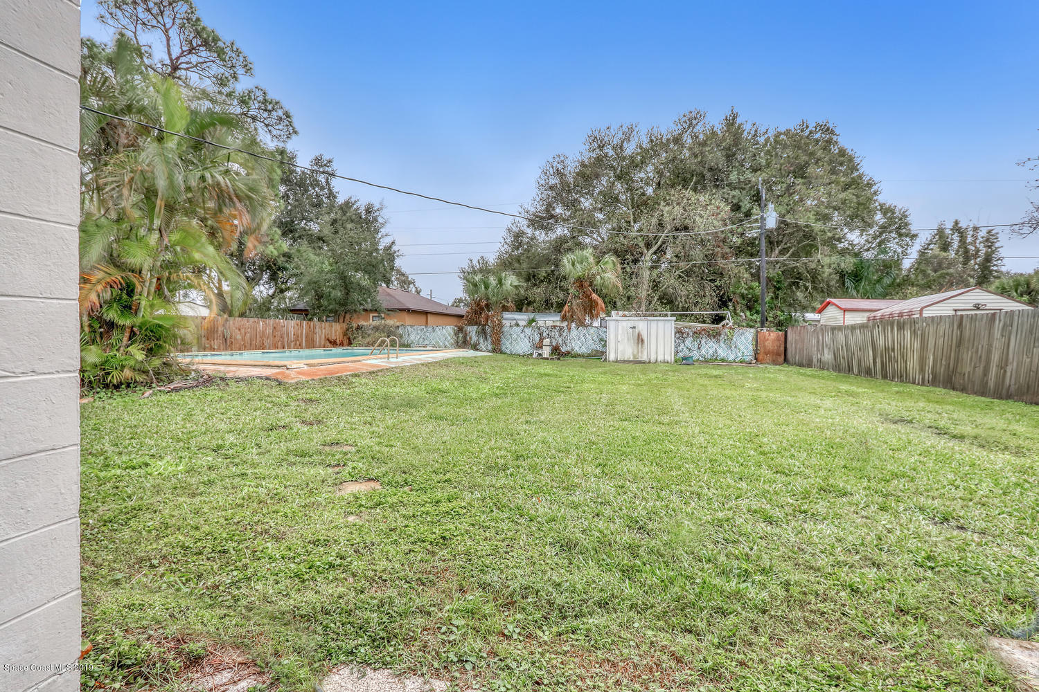 1003 Pinedale Road Rockledge, FL 32955 - Photo 18 of 19 a view of a back yard