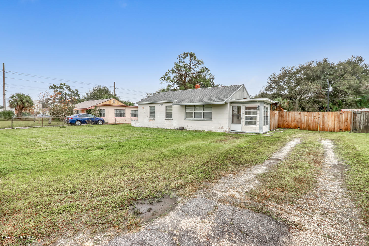 1003 Pinedale Road Rockledge, FL 32955 - Photo 3 of 19 a view of a house with a yard