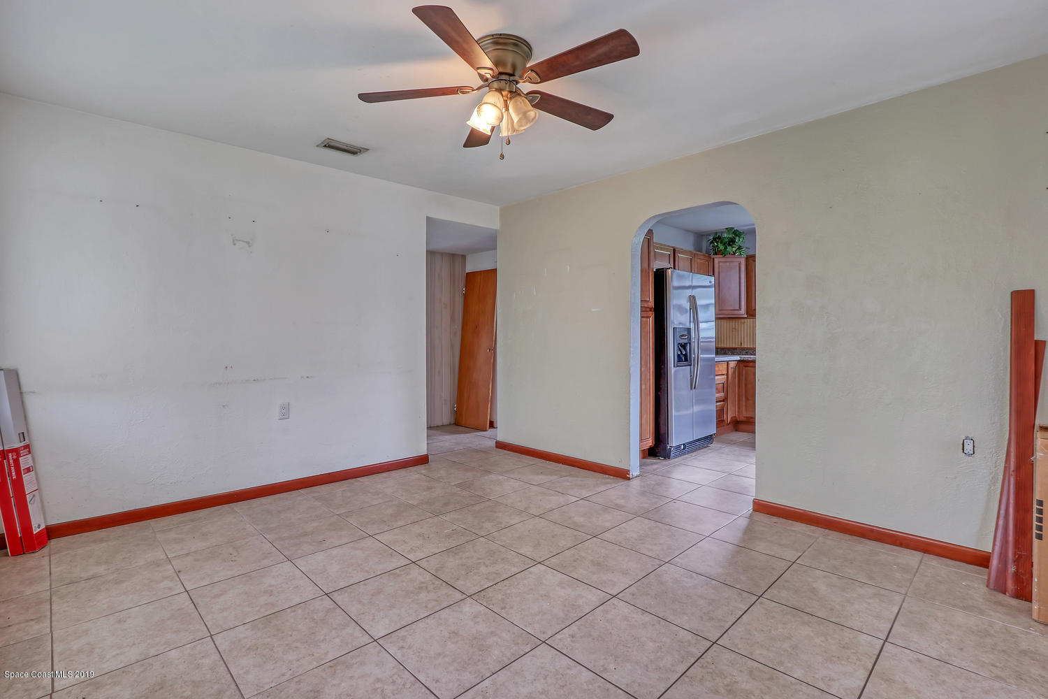 1003 Pinedale Road Rockledge, FL 32955 - Photo 6 of 19 an empty room with closet and fan