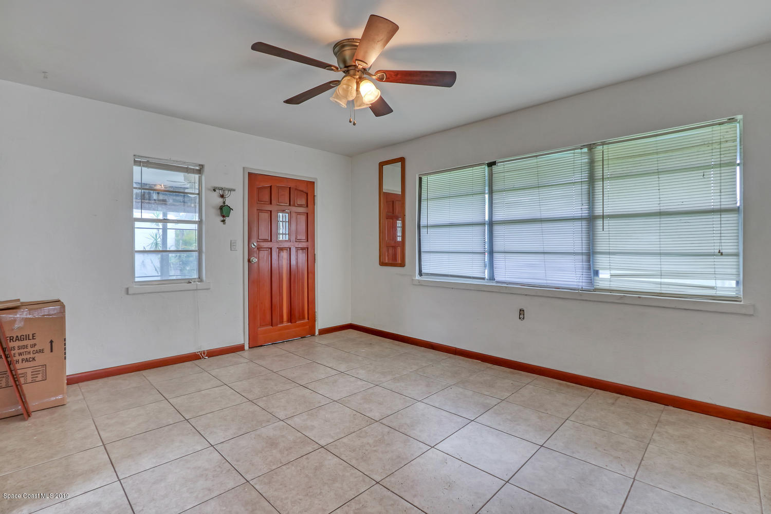 1003 Pinedale Road Rockledge, FL 32955 - Photo 7 of 19 a view of an empty room with a window