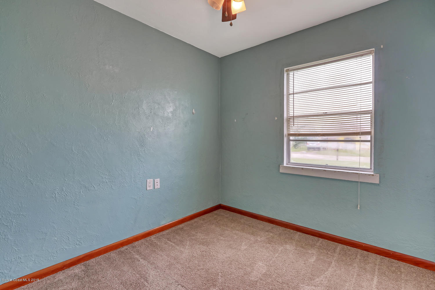 1003 Pinedale Road Rockledge, FL 32955 - Photo 10 of 19 an empty room with a window