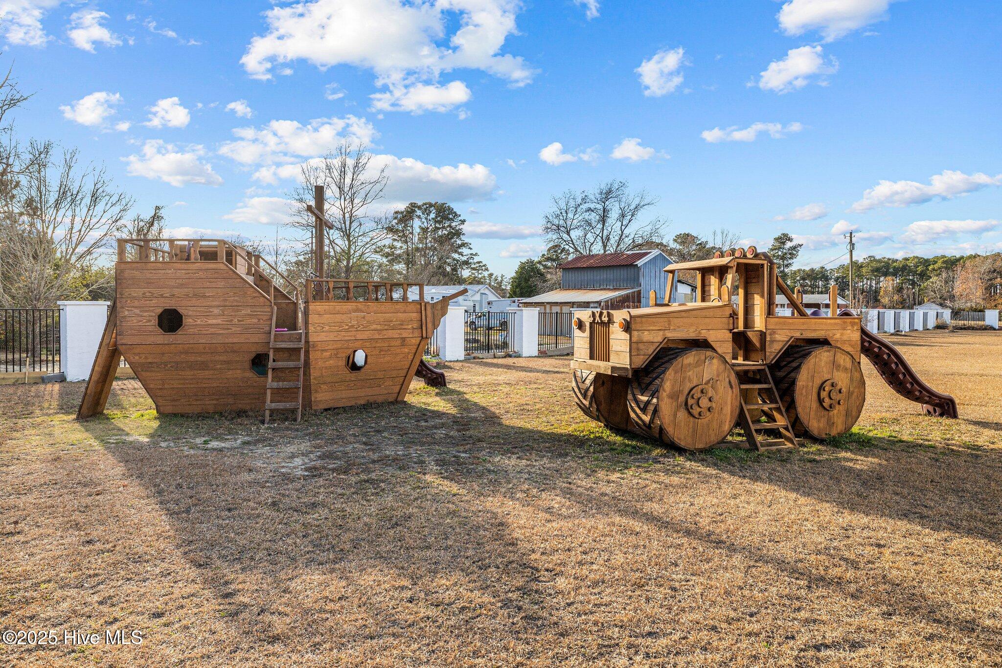 490 Whitehouse Fork Road Peletier, NC 28584 - Photo 46 of 61 Wooden boat and truck playground set negotiable